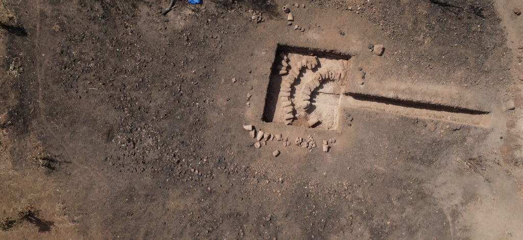 Aerial view of the Did&eacute; Ouest 1 iron reduction site in Senegal following excavation, showing an unusual deposit of used tuy&egrave;res arranged in two semicircles
