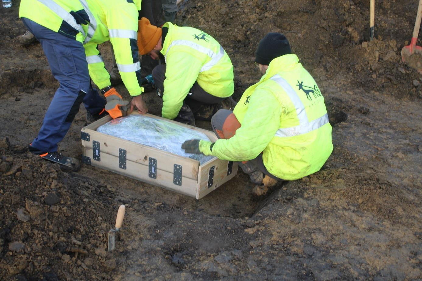 Archaeologists remove the Ahlum Hoard as a block
