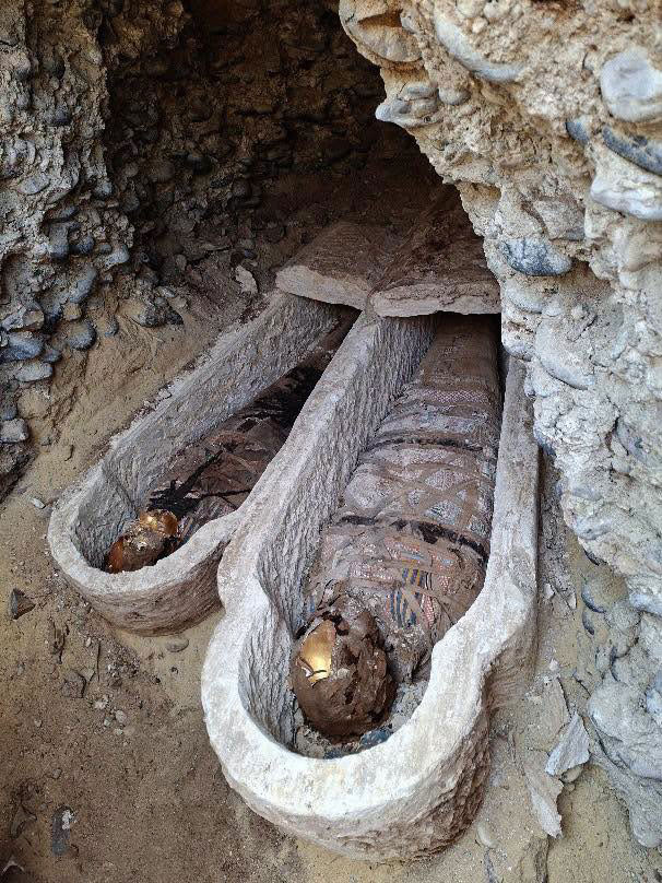 Linen-wrapped mummified bodies in coffins, Al-Bahnasa, Egypt