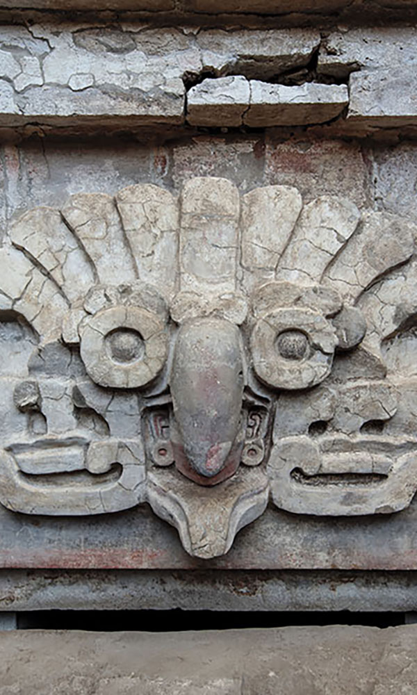 Stucco owl headdress relief