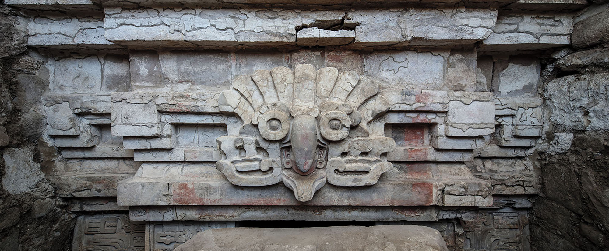 Stucco owl headdress relief