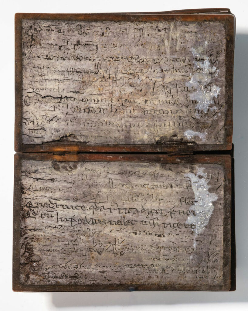 Wax tablet notebook with inscribed Latin text