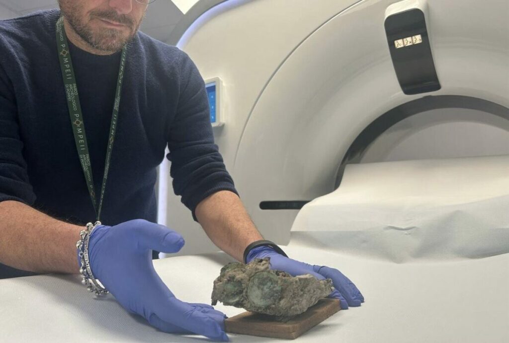 A researcher analyzes the fabric bag recovered from Pompeii's Garden of the Fugitives.