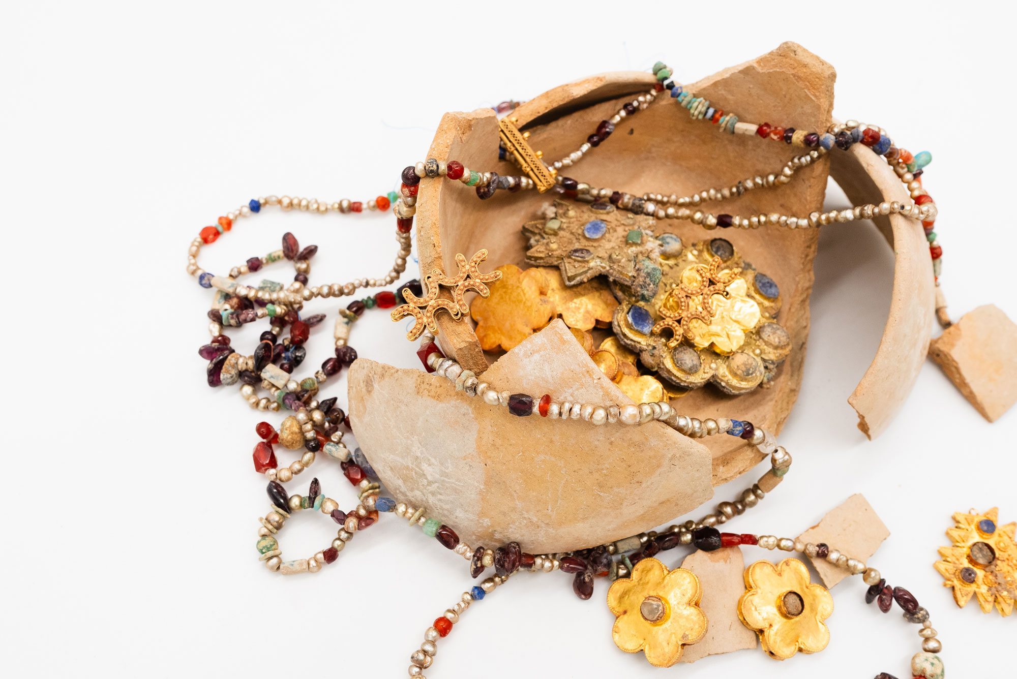 Jewelry hoard in ceramic jar
