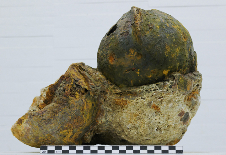 Fragmented iron helmets with traces of paint and patina