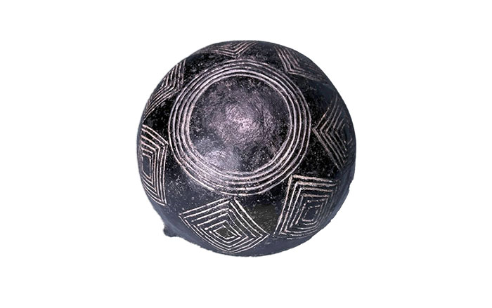 Bottom of Black Polished ware hemispherical bowl with incised decoration