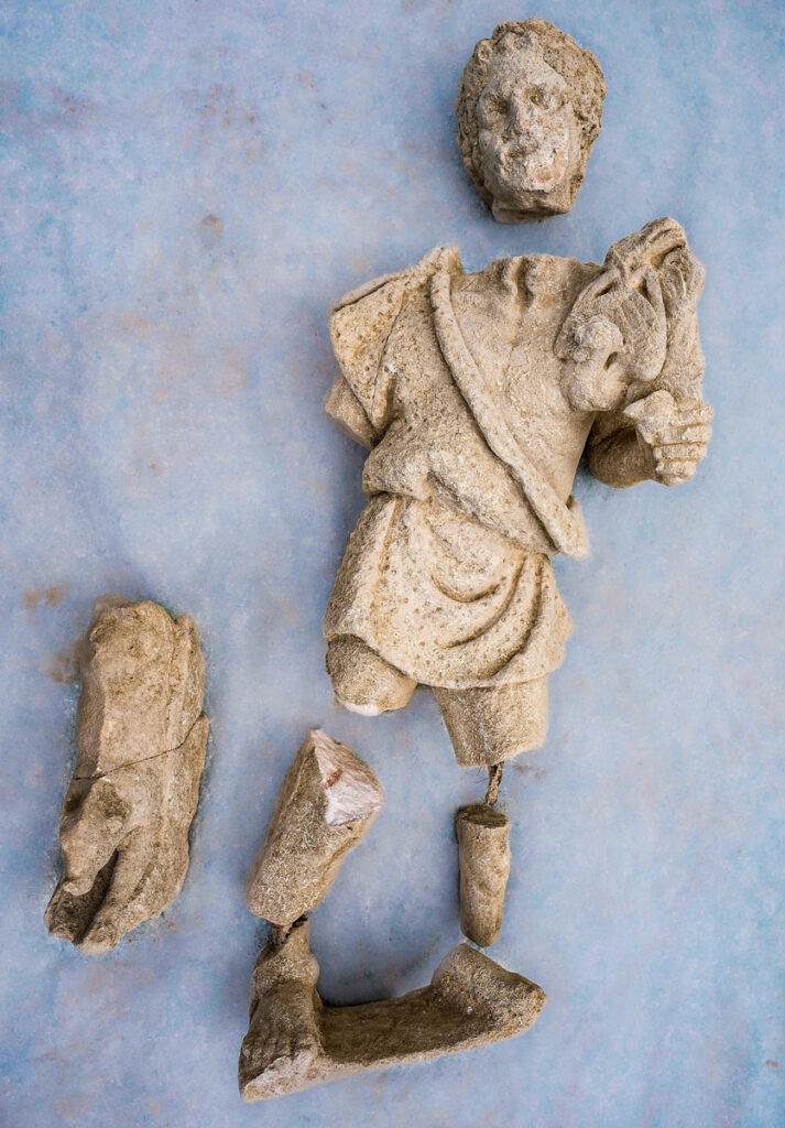Fragments of a statue depicting a bearded man