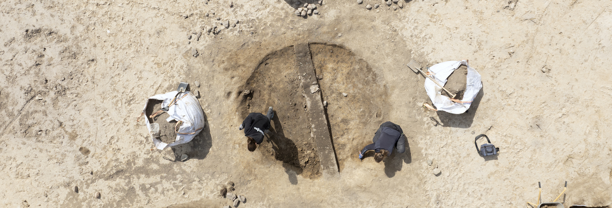 Archaeologists excavating a pit house, Søften, Denmark