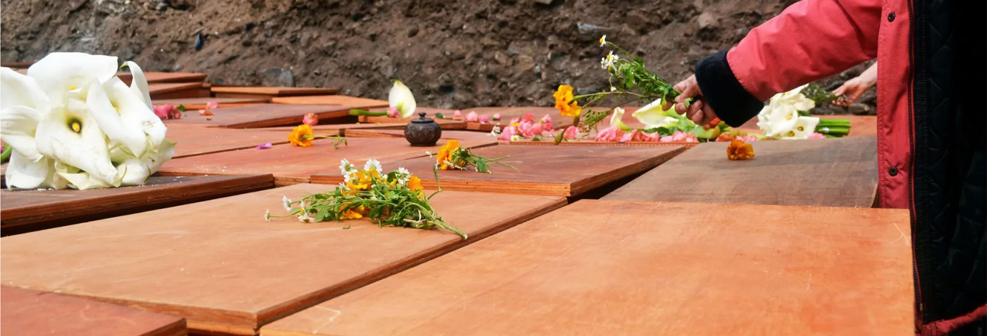Boxes carrying remains of liberated Africans before they were reburied in 2022
