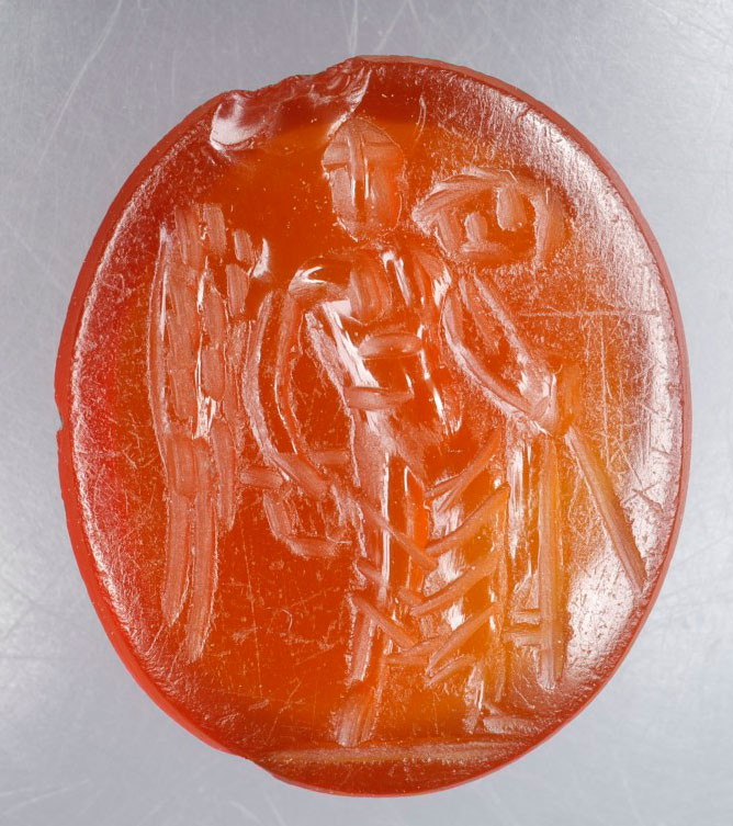 Carnelian gem depicting the goddess Victoria with a staff and wreath