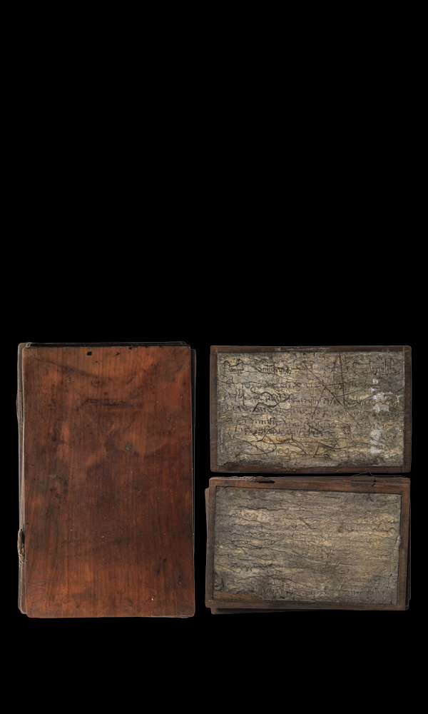 Wood notebook (left) and wax-covered pages (right)