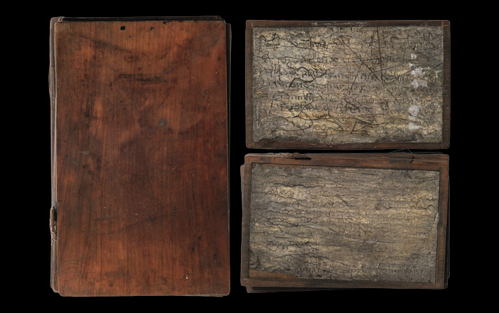 Wood notebook (left) and wax-covered pages (right)