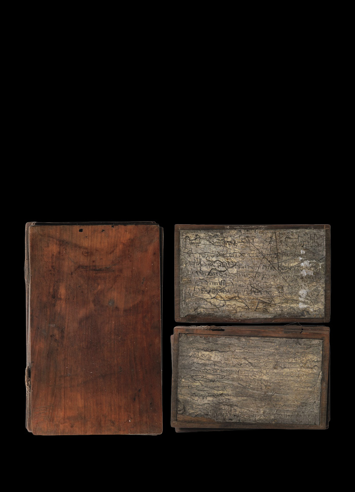 Wood notebook (left) and wax-covered pages (right)