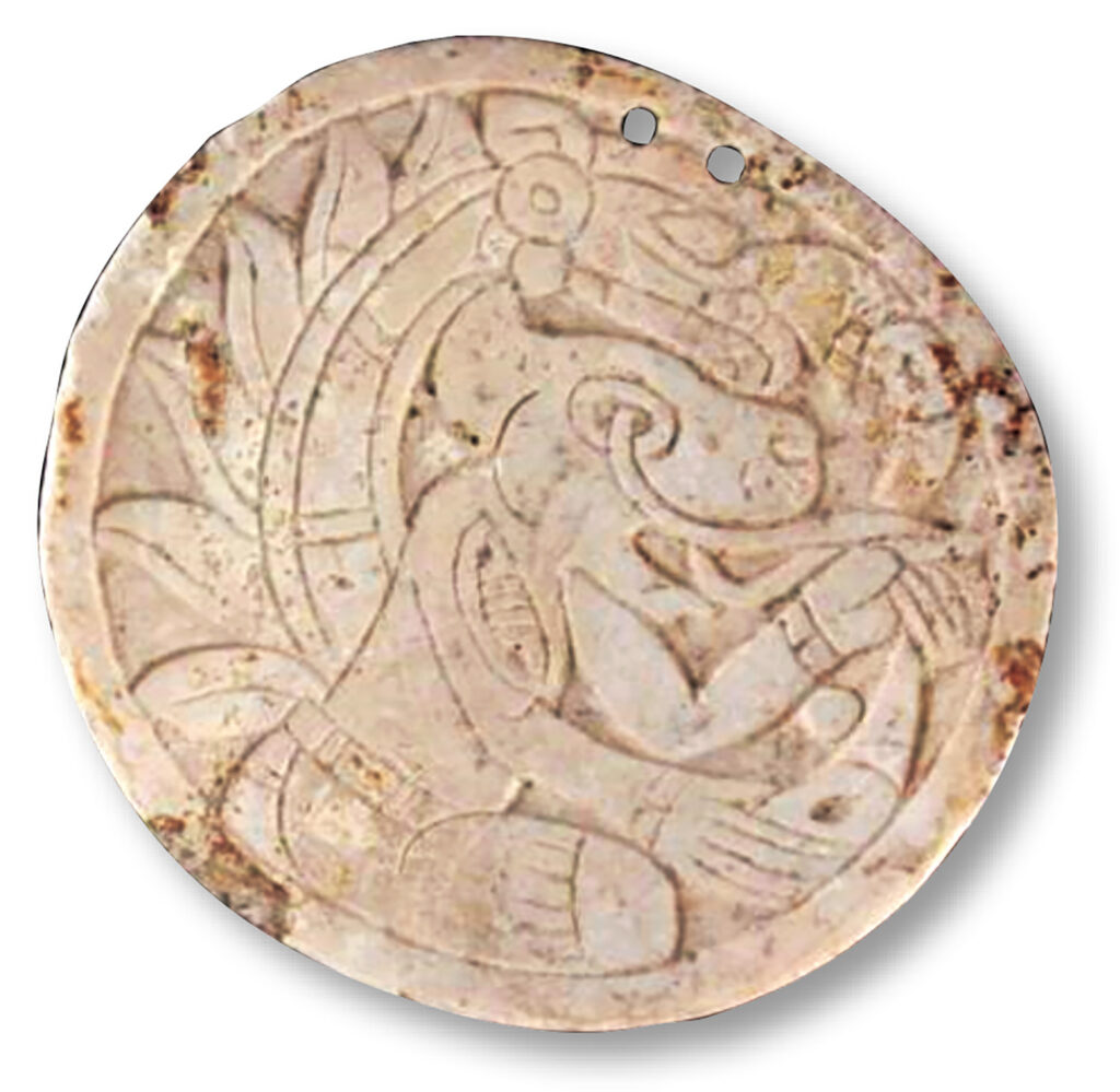 Carved shell disk