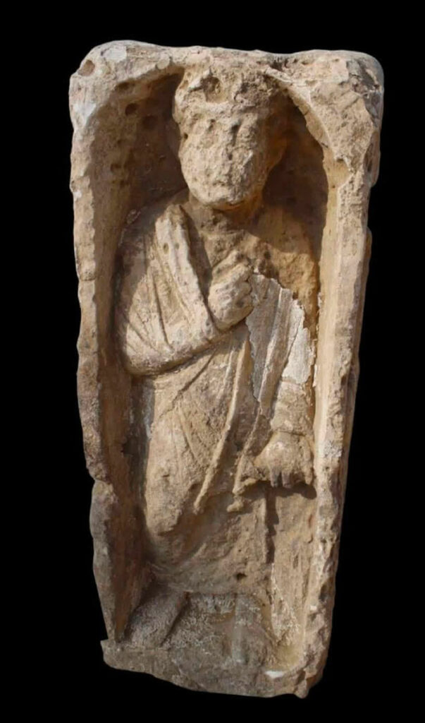 Limestone funerary stele of a man wearing a toga
