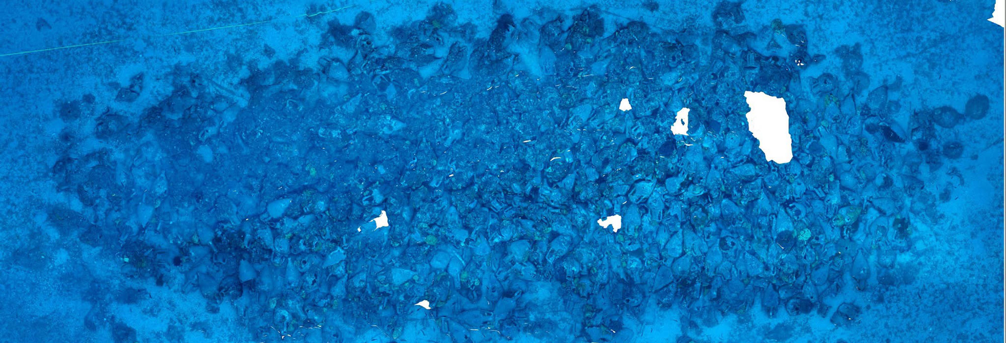 Overhead view of concentration of amphoras at the site of an ancient shipwreck, Andros, Greece