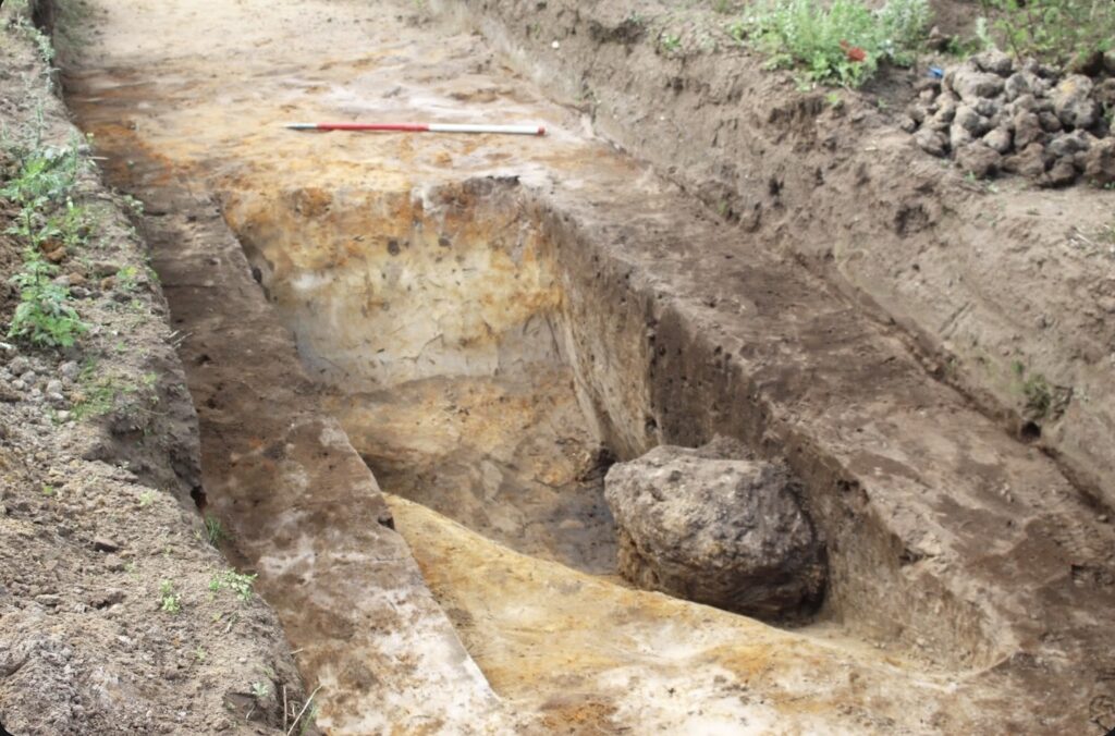 Excavation trench with industrial waste at Thornton Solar Farm, England