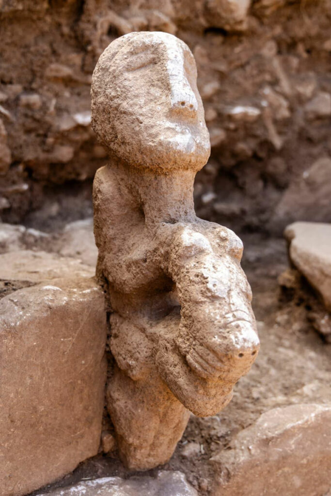 Statue depicting a human sitting atop a leopard, Karahantepe, Turkey