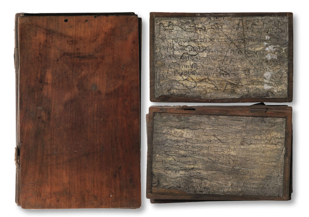 Wood notebook (left) and wax-covered pages (right)