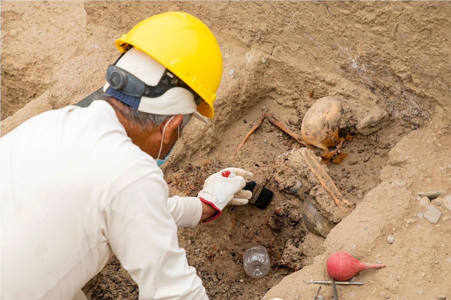 Excavation of burial in a funeral platform, Chan Chan, Peru