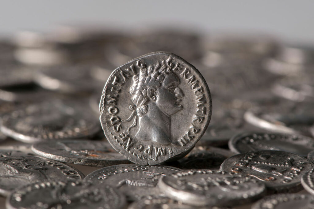 Silver coin showing an image of Domitian in profile
