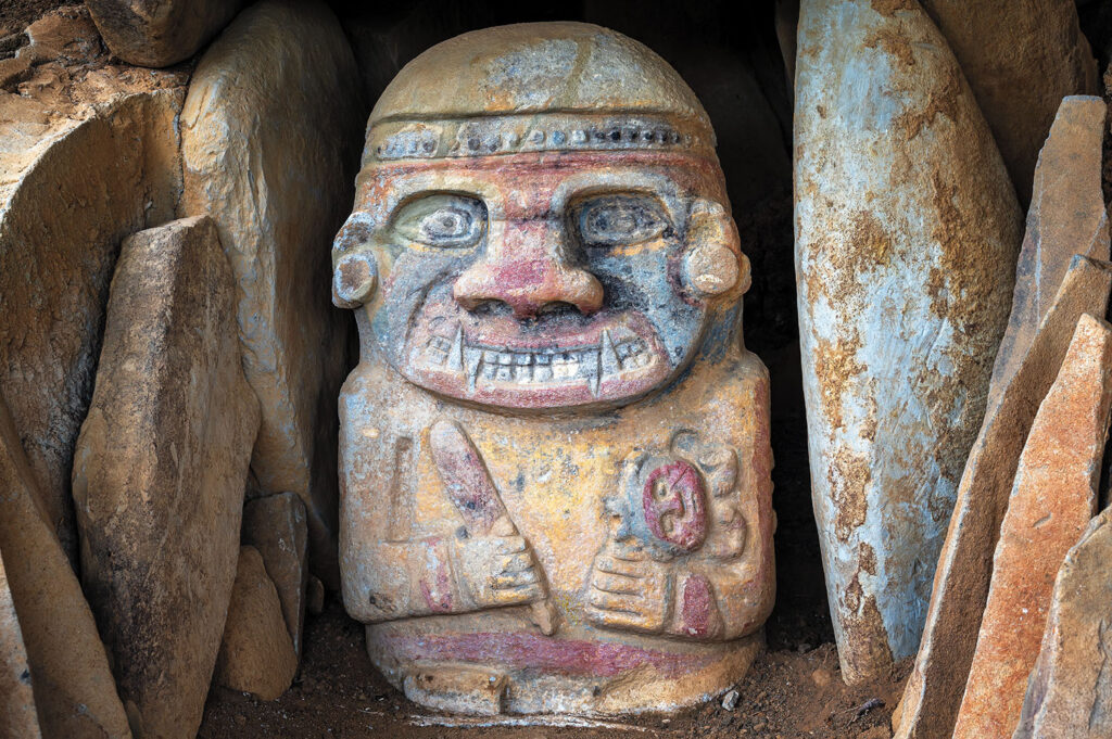 Figure wearing king vulture mask, San Agustin, Colombia