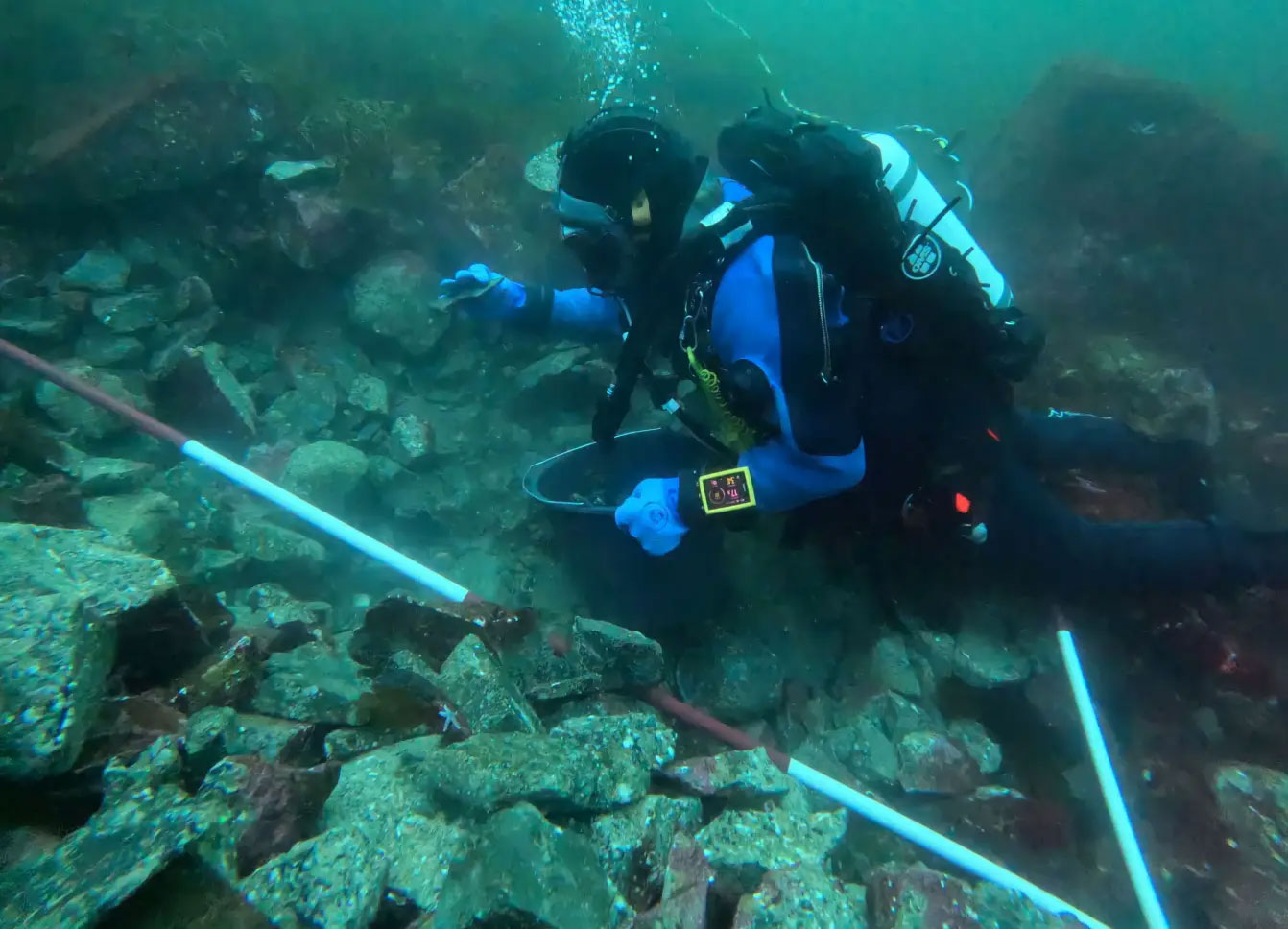 Archaeologist Beatrice Frabetti from the Bergen Maritime Museum examines quarry debris off the western coast of Norway