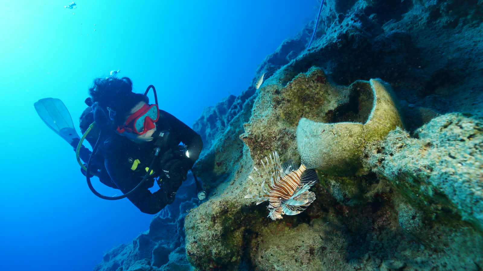 An underwater archaeologist observes an amphora, Kekova, Turkey.