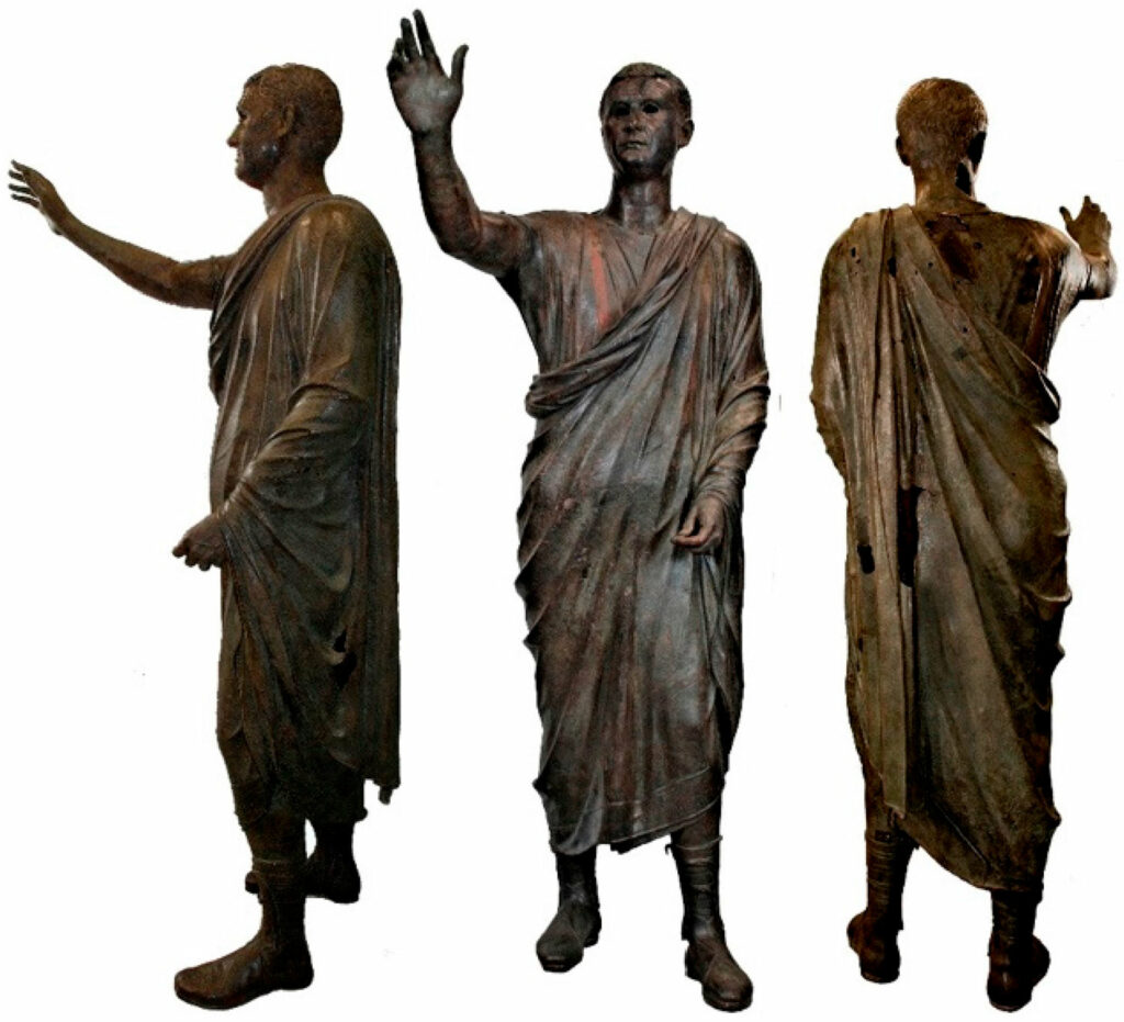 Three views of the Arringatore statue after restoration in 2008