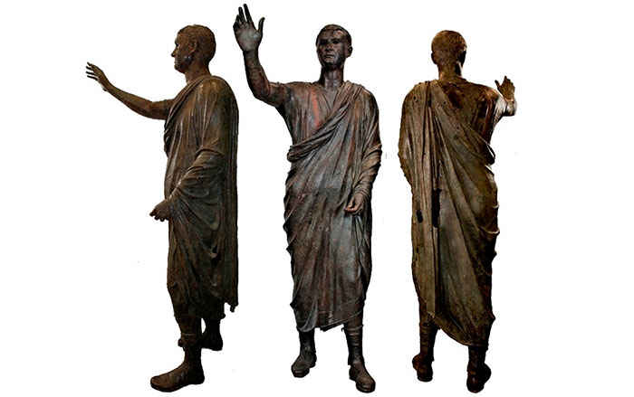 Three views of the Arringatore statue after restoration in 2008